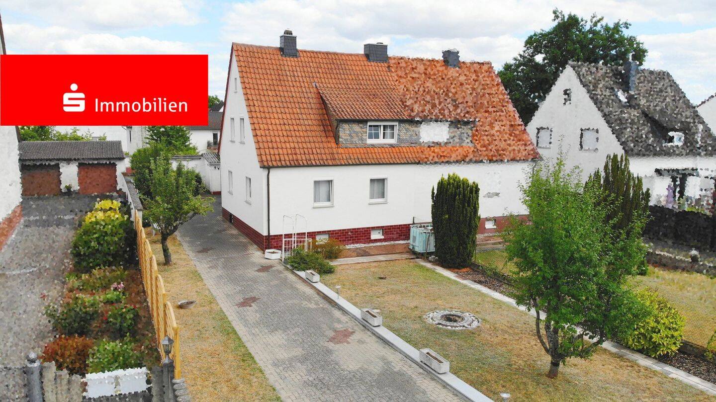 Charmante Doppelhaushälfte mit großem Sonnengrundstück in begehrter Lage von Urberach, 63322 Rödermark