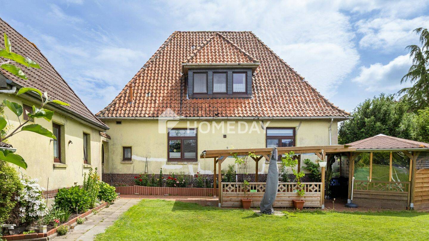 Viel Platz für die ganze Familie – Einfamilienhaus mit großem Garten auf über 1.000 m² Grundstück, 26936 Stadland