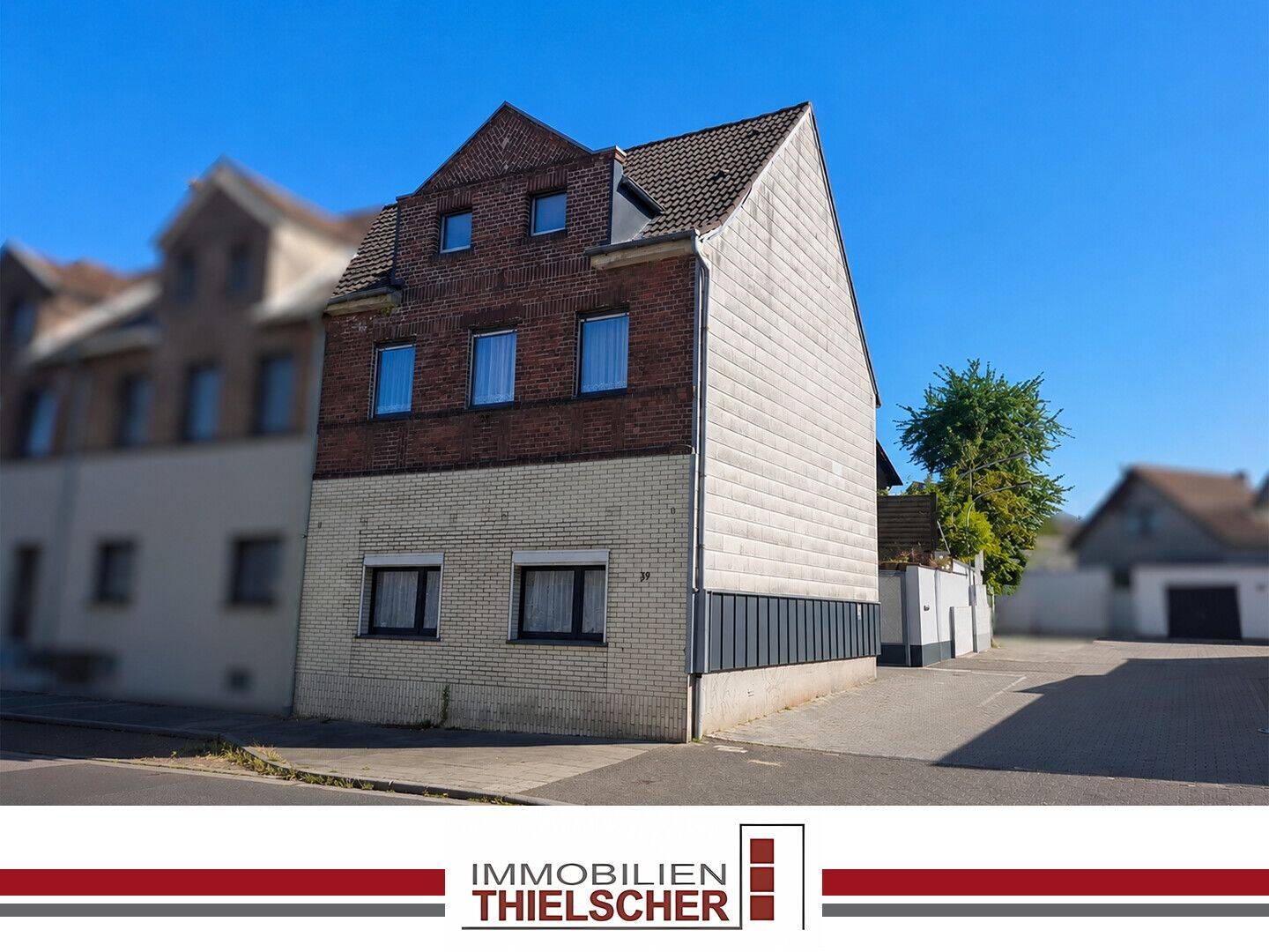 Mehrfamilienhaus mit drei vermieteten Wohneinheiten und Gartenanteil in Übach-Palenberg, 52531 Übach-Palenberg