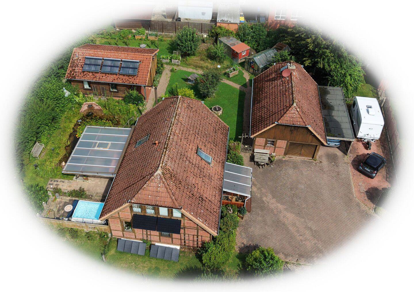 Vielseitiges Wohn-Ensemble in Rosche: Gepflegtes Einfamilienhaus mit autarkem Gästehaus, großem Nebengebäude & Traumgarten!, 29571 Rosche