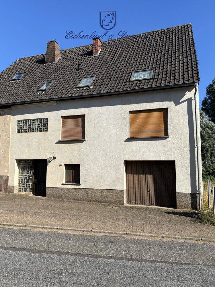 Großzügiges Einfamilienhaus mit Garage und kleinem Garten, 66265 Heusweiler