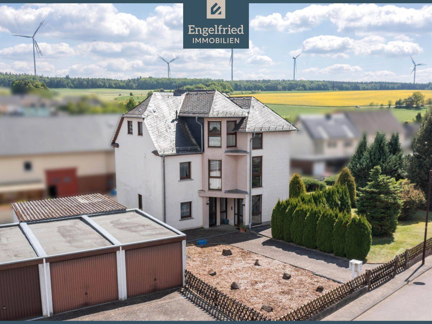 Gepflegtes Dreifamilienhaus mit Anbau und Garagenhof auf weitläufigem Baugrundstück, 56291 Kisselbach