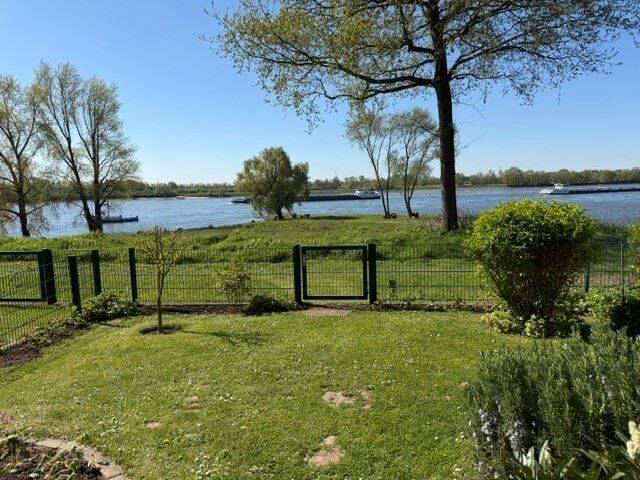 Erdgeschosswohnung mit Rheinblick und kleinem Garten, 46459 Rees