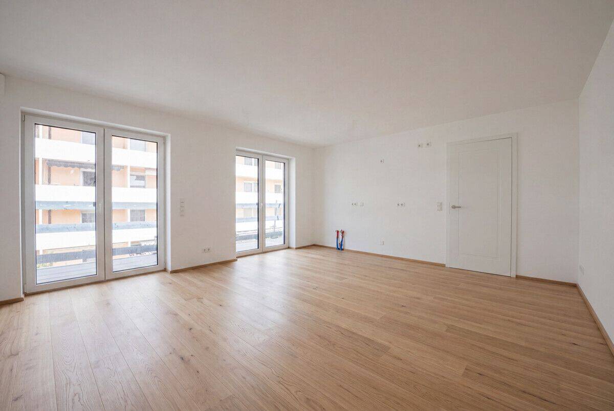 Sonnenverwöhnte Eckwohnung mit umlaufendem Balkon und Tageslicht-Badezimmer – Erstbezug Sept. 2026