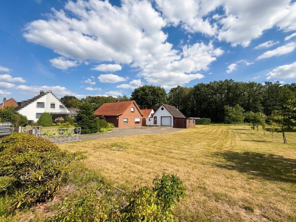 Dörverden-Westen: Gemütliches Einfamilienhaus mit Anbauten, Kaminofen und unterkellertem Garagenhaus, 27313 Dörverden