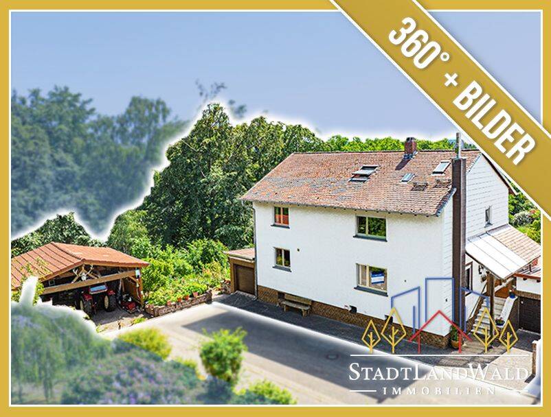 Gepflegtes Zweifamilienhaus mit großem Garten, Carport und Garagen in Clausen, 66978 Clausen