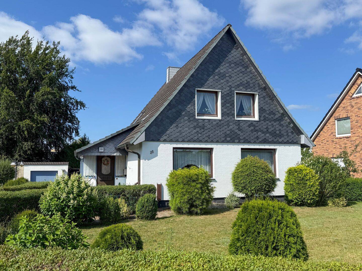 Familienfreundliches Einfamilienhaus mit gepflegtem Garten und Garage, 25436 Uetersen