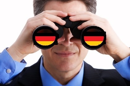 home search in germany: photo shows man  looking through binoculars