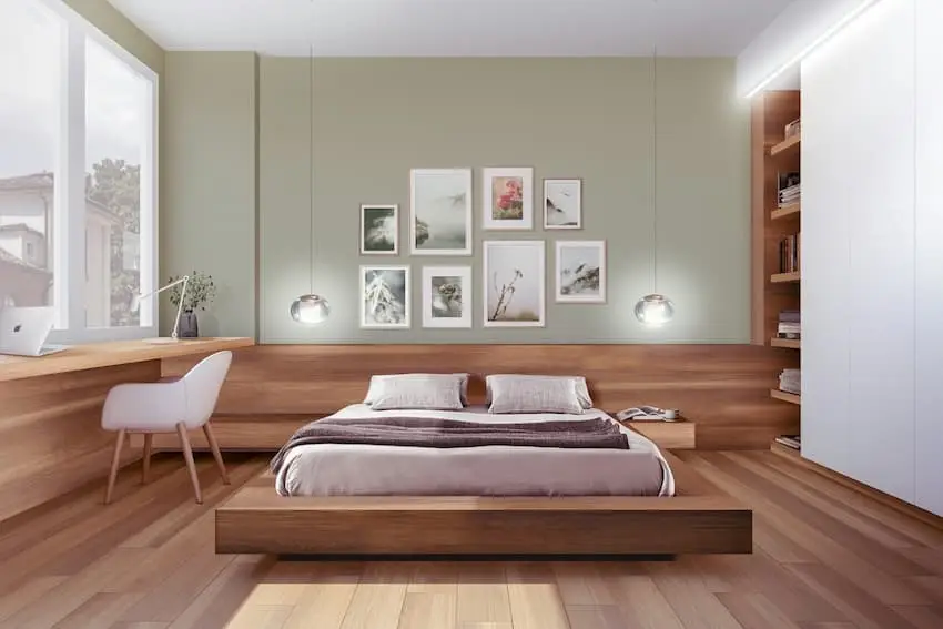 Wohnung einrichten: Tipps für das Schlafzimmer 2 Wohnung einrichten: Tipps für das Schlafzimmer: Bild zeigt lindgrüne Schlafzimmerwand mit hellen Bildern, davor 2-er Bett mit Holzkasten auf Holzboden.
