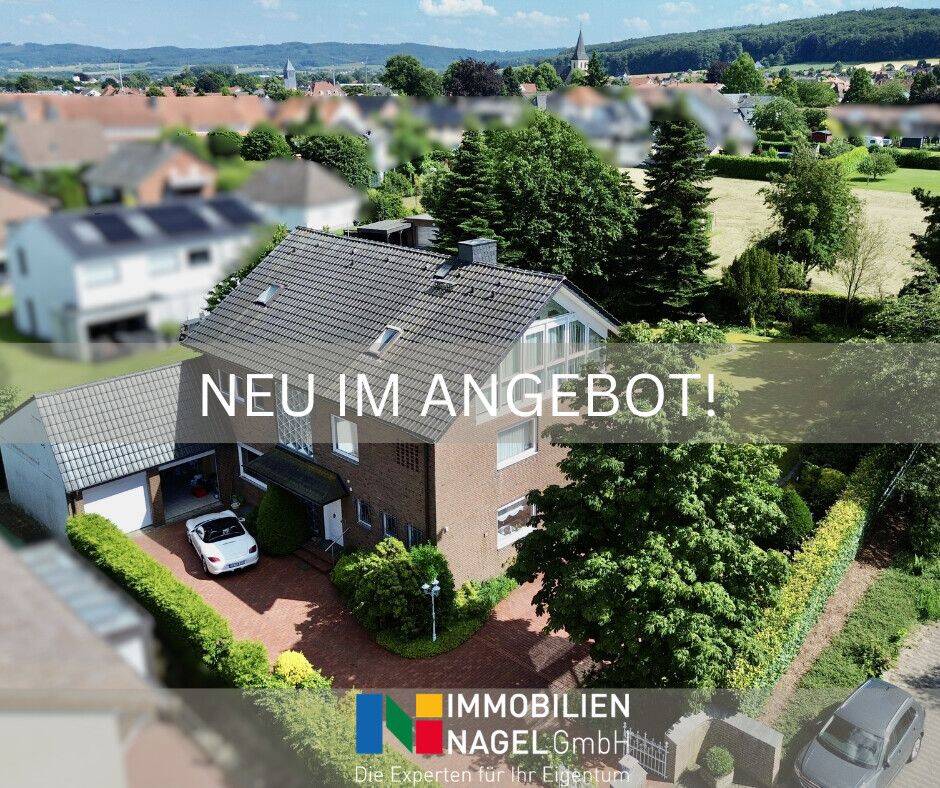 Grüne Oase mitten in Preußisch Oldendorf – Familienhaus mit viel Raum und Charme, 32361 Preußisch Oldendorf