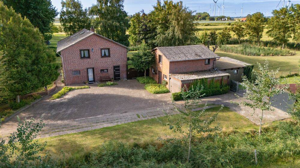 Solides Einfamilienhaus in herrlicher, ruhiger Wohnlage mit Blick über die Felder in Strübbel, 25792 Strübbel