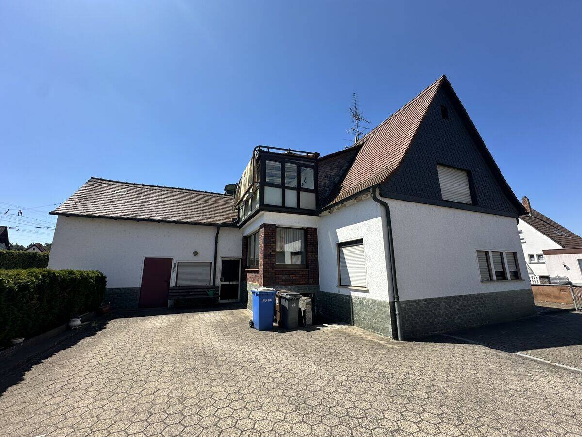 Großzügiges Einfamilienhaus mit 949 m² Grundstück, Wintergarten, Doppelgarage & viel Potenzial, 63811 Stockstadt a. Main