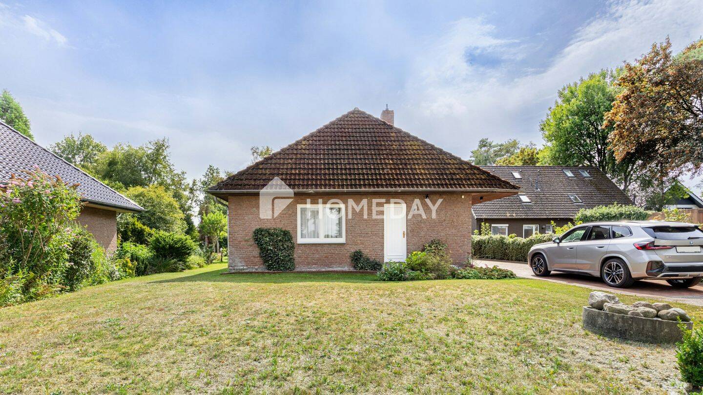 Wohnen auf einer Ebene: Gepflegter Bungalow mit großem Garten und Kamin, 28879 Grasberg
