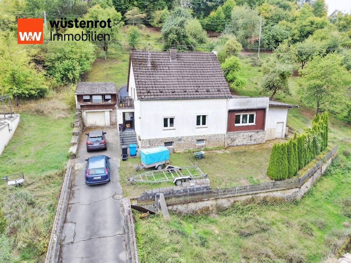 Freistehendes Einfamilienhaus mit Nebengebäuden, großem Grundstück und viel Potential in Bettingen, 54646 Bettingen